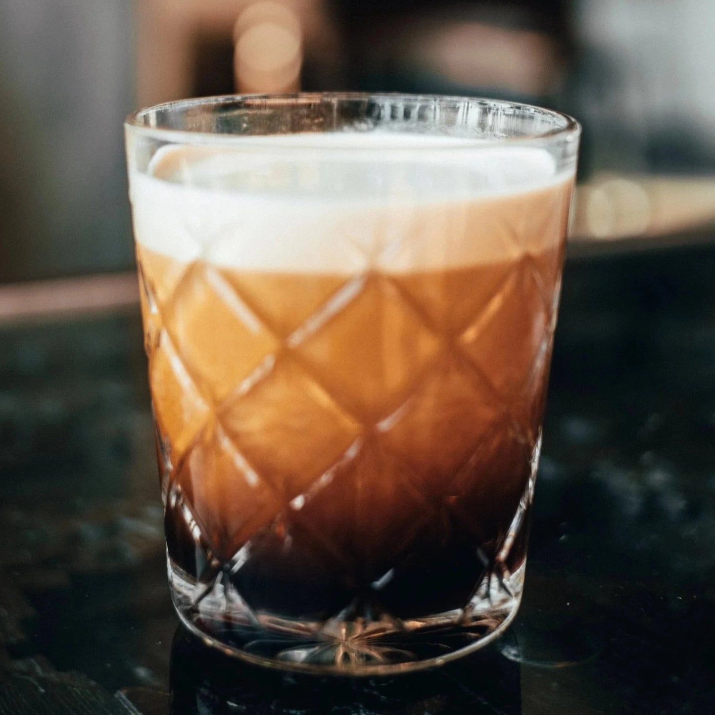 cortado coffee in a glass cup