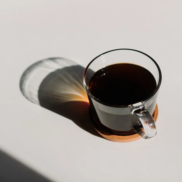 glass cup with handle with black coffee