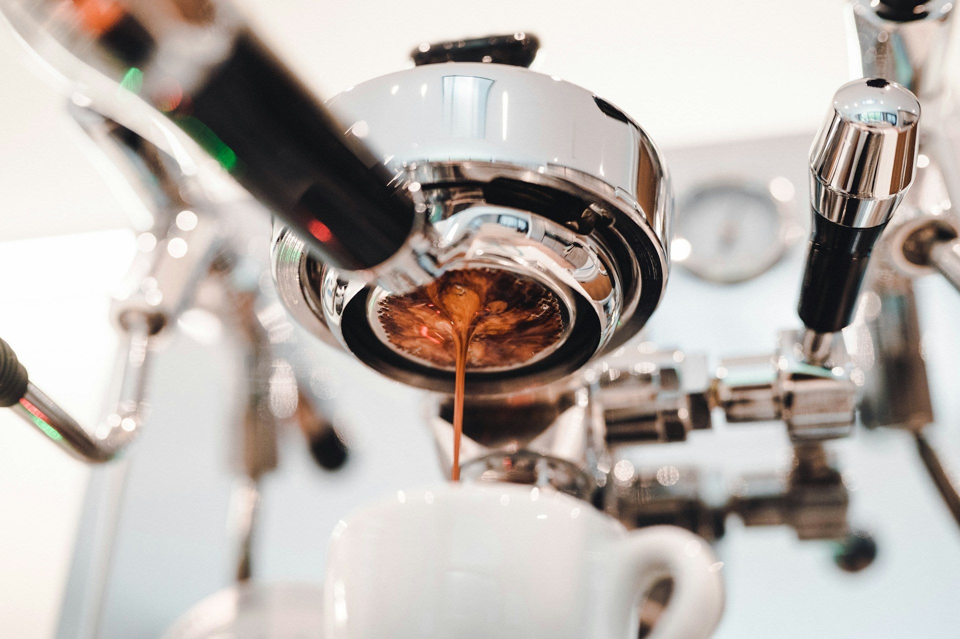 bottomless portafilter pulling a shot of espresso