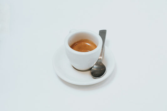 espresso in an white espresso cup with spoon