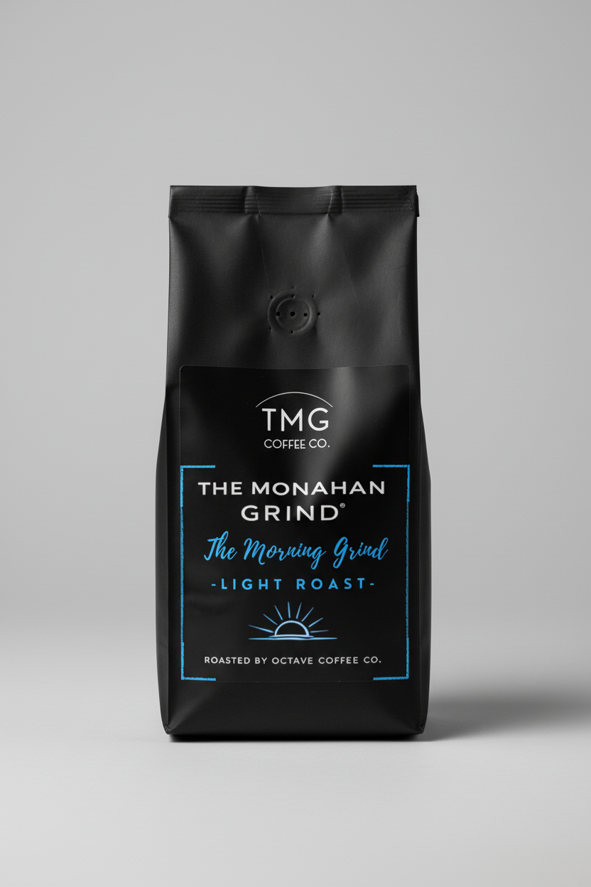 Coffee packaging for TMG Coffee Co. with 'The Monahan Grind' and 'The Morning Grind' text on a black background.