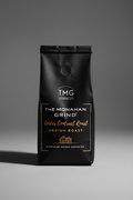 Coffee label for The Monahan Grind with TMG Coffee Co. branding on a black background.